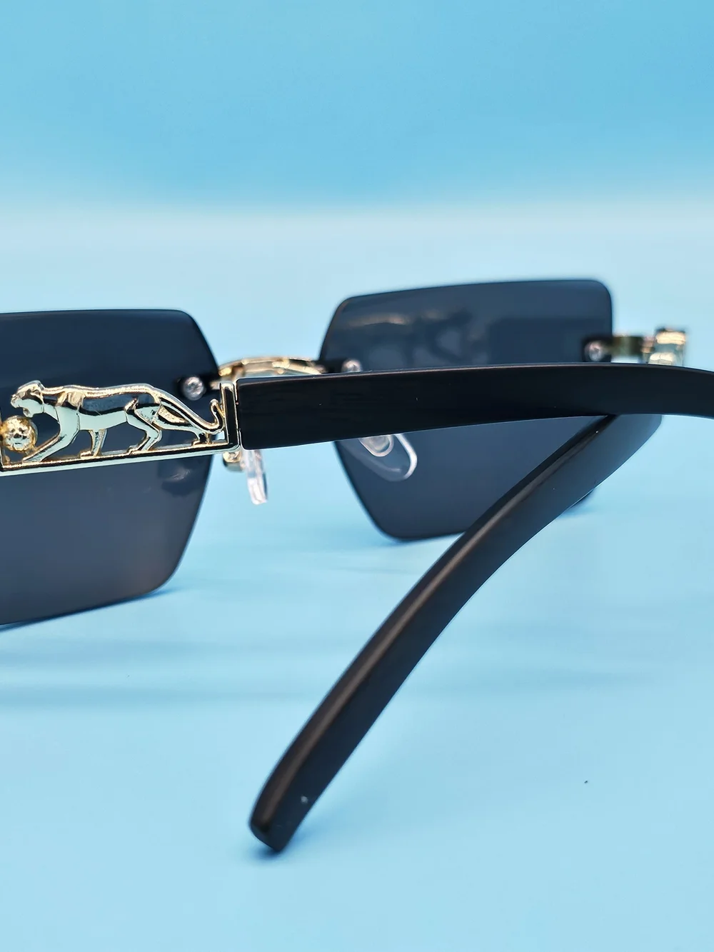Men's Black and Gold Rimless Sunglasses